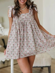 Flowy Printed Square Neck Tie Shoulder Mini Dress with pink circular floral print and tie straps for summer chic fashion.