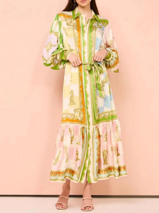 Printed tie waist lantern sleeve dress with pastel stripes and ornate gold accents, featuring a button-down front and balloon sleeves.