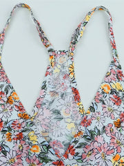 Close-up of back straps on Floral Surplice Cami Tops & Tees GirlSavvi showcasing floral fabric and T-back design.