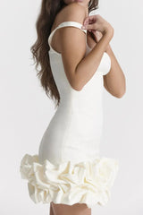 Side profile of white Ruched Square Neck Sleeve Mini Dress by GirlSavvi, highlighting bodycon fit and sculpted ruffle trim.