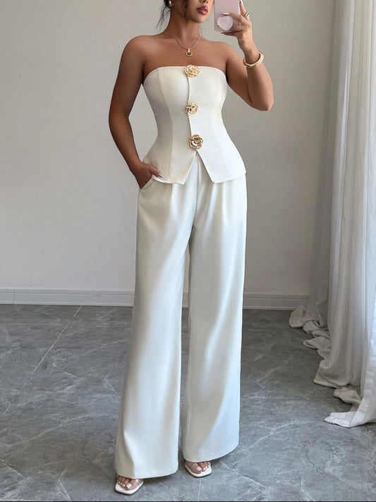 Woman wearing a white tube top and wide-leg pants set, showcasing stylish co-ord fashion for versatile occasions.