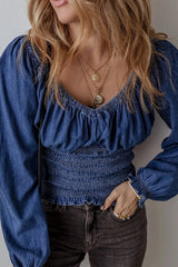 Close-up of Chic Smocked Long Sleeve Top in Denim showing textured smocking and soft puff sleeves for a flattering silhouette.