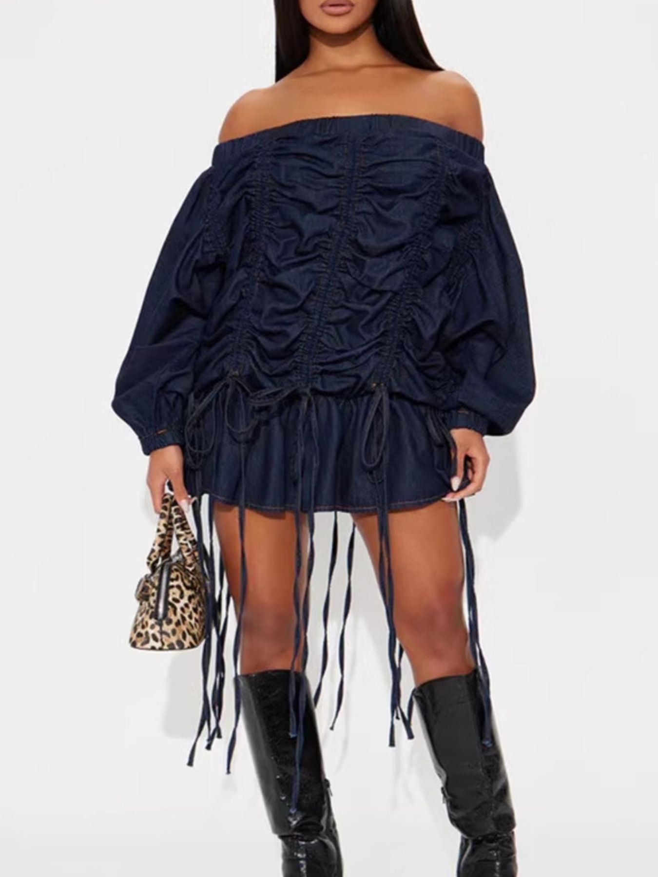 Off-Shoulder Ruched Denim Dress featuring ruched details and drawstrings, styled with a chic handbag.