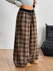 Woman wearing GirlSavvi’s Plaid Wide Leg Pants with relaxed fit and drawstring waist.