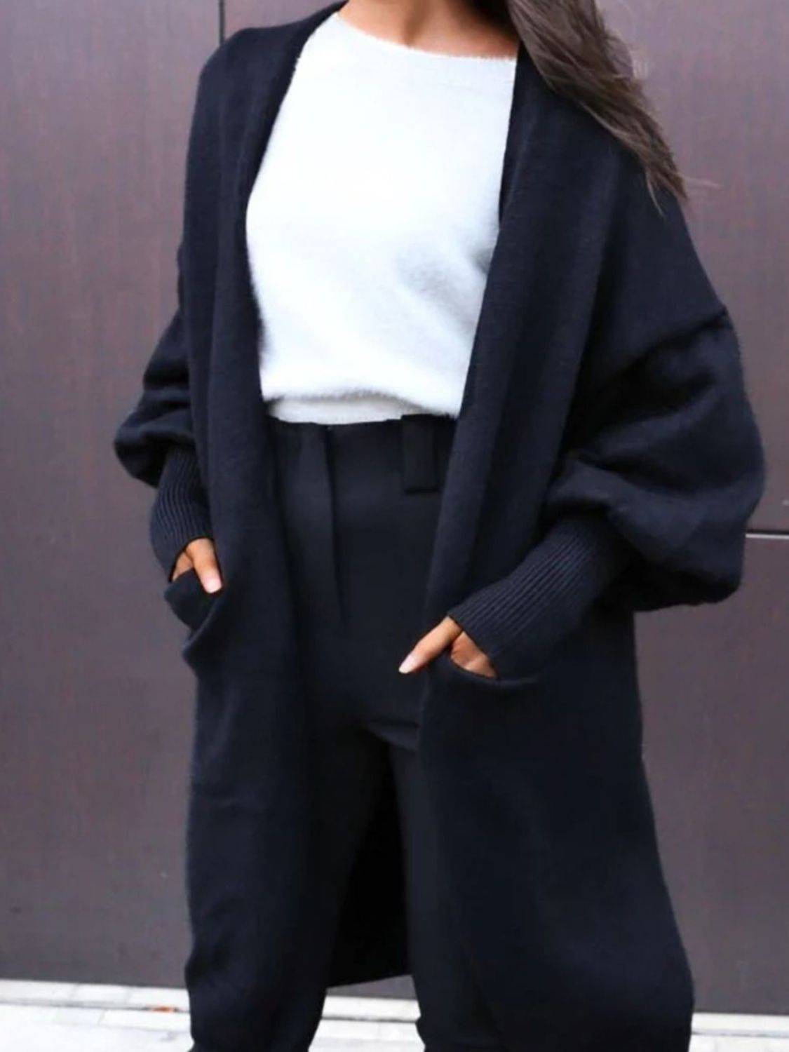 Perfee Open Front Dropped Shoulder Cardigan in black styled with high-waisted pants, a cozy & chic layering piece for casual or office wear.