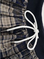 Close-up of ruched drawstring on plaid skort, showcasing the classic design of the Drawstring Plaid Skort with adjustable detail.