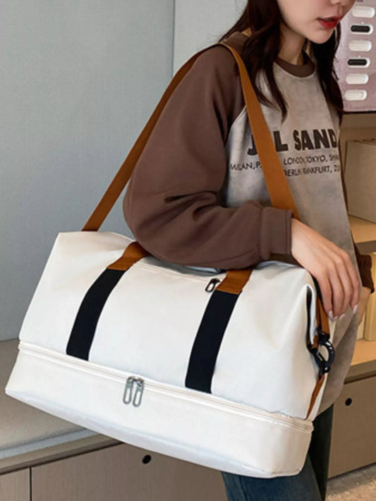 Woman carrying a Multifunctional Waterproof Travel Duffel Bag with brown straps, perfect for travel and gym use.