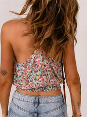 Back view of Floral Surplice Cami Tops & Tees GirlSavvi featuring racerback straps and floral pattern, paired with high-waisted denim.