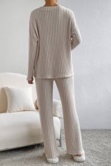 Back view of Plus Size Ribbed V-Neck Drop Shoulder Top and Pants Set showing full-length ribbed pants and long-sleeve top, perfect for cozy lounging.