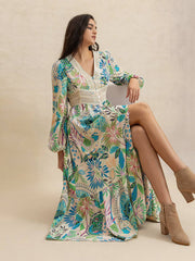 Effortlessly Chic Slit Printed V-Neck Long Sleeve Midi Dress styled seated, showcasing front slit and colorful botanical print.