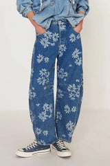 Flower Print Wide Leg Pants showcasing a floral design on denim, styled with a casual tee and sneakers.