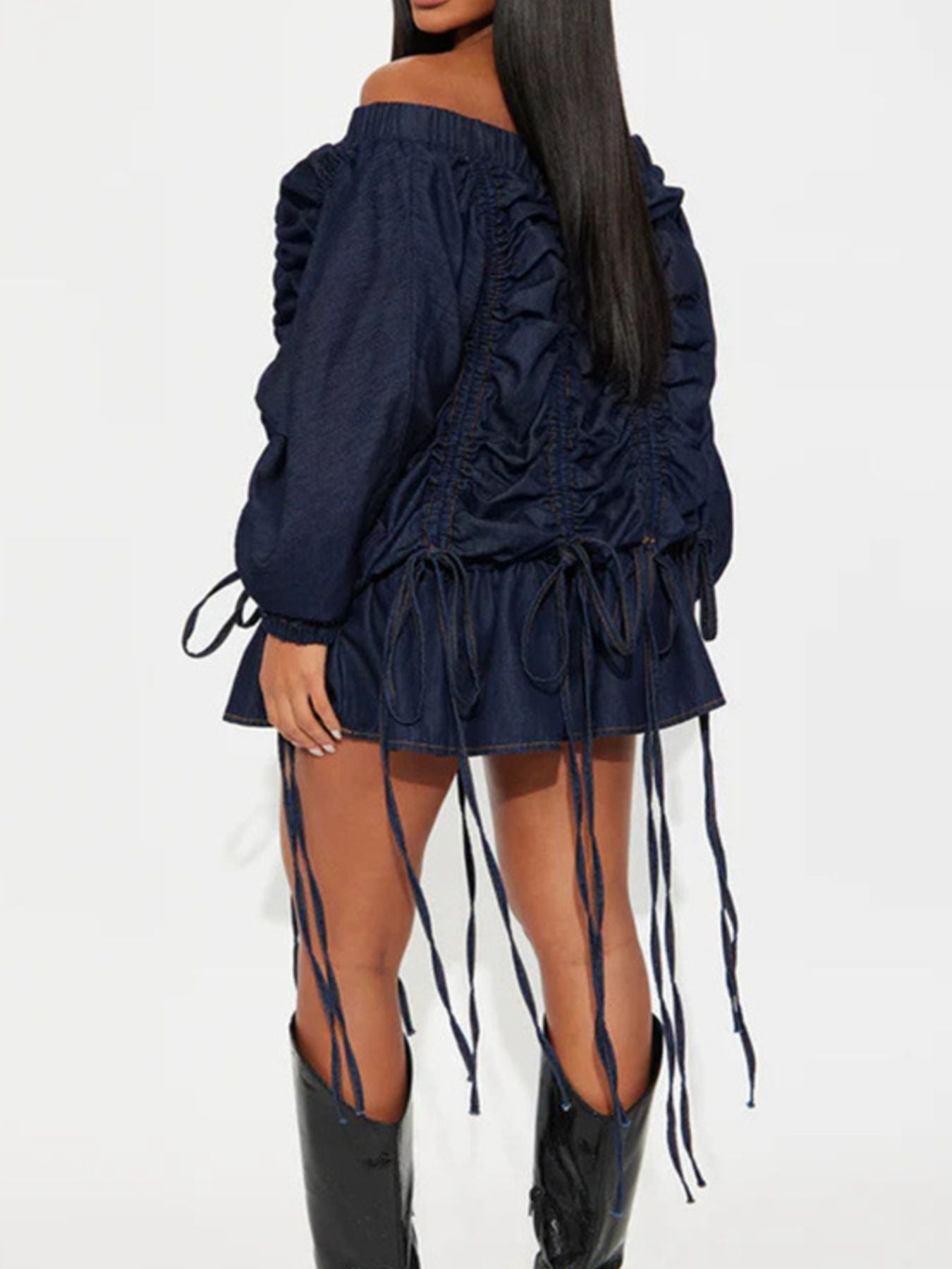 Model showcasing Off-Shoulder Ruched Denim Dress with ruffled details and drawstring adjustments.