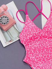 Close-up of pink Leopard Plunge Swimwear highlighting double spaghetti straps and bold animal print pattern.