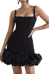 Front pose of black Ruched Square Neck Sleeve Mini Dress by GirlSavvi, showcasing sleek fit and statement ruffled hemline.