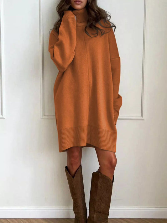 Woman wearing Solid Color Turtleneck Drop Shoulder Loose Sweater Dress with boots, standing against a white backdrop.