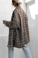 Back view of houndstooth collared coat showcasing its relaxed fit and bold check pattern, styled with light denim for casual elegance.