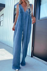 Front view of light blue V-Neck Sleeveless Denim Jumpsuit with wide-leg silhouette and stitched detailing on chest.