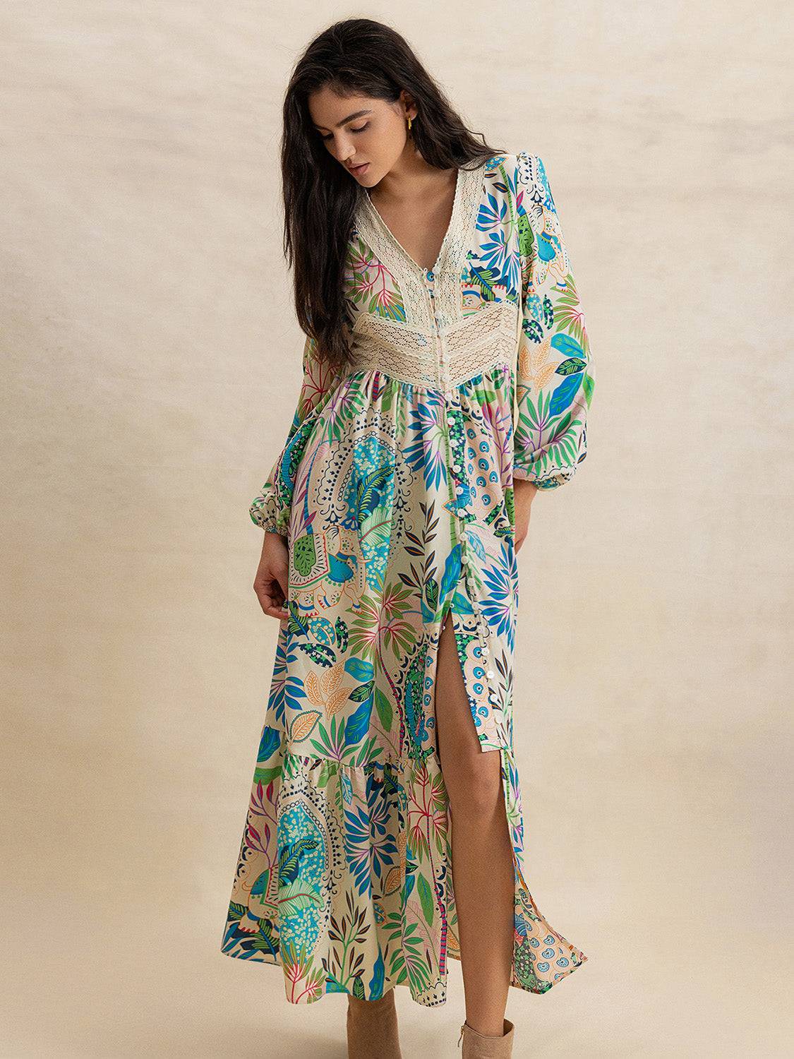 Effortlessly Chic Slit Printed V-Neck Long Sleeve Midi Dress with buttoned front and vibrant print, styled with tan heeled boots.
