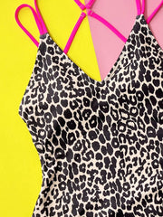 Close-up of classic Leopard Plunge Swimwear showing detailed leopard print and vibrant pink double straps.