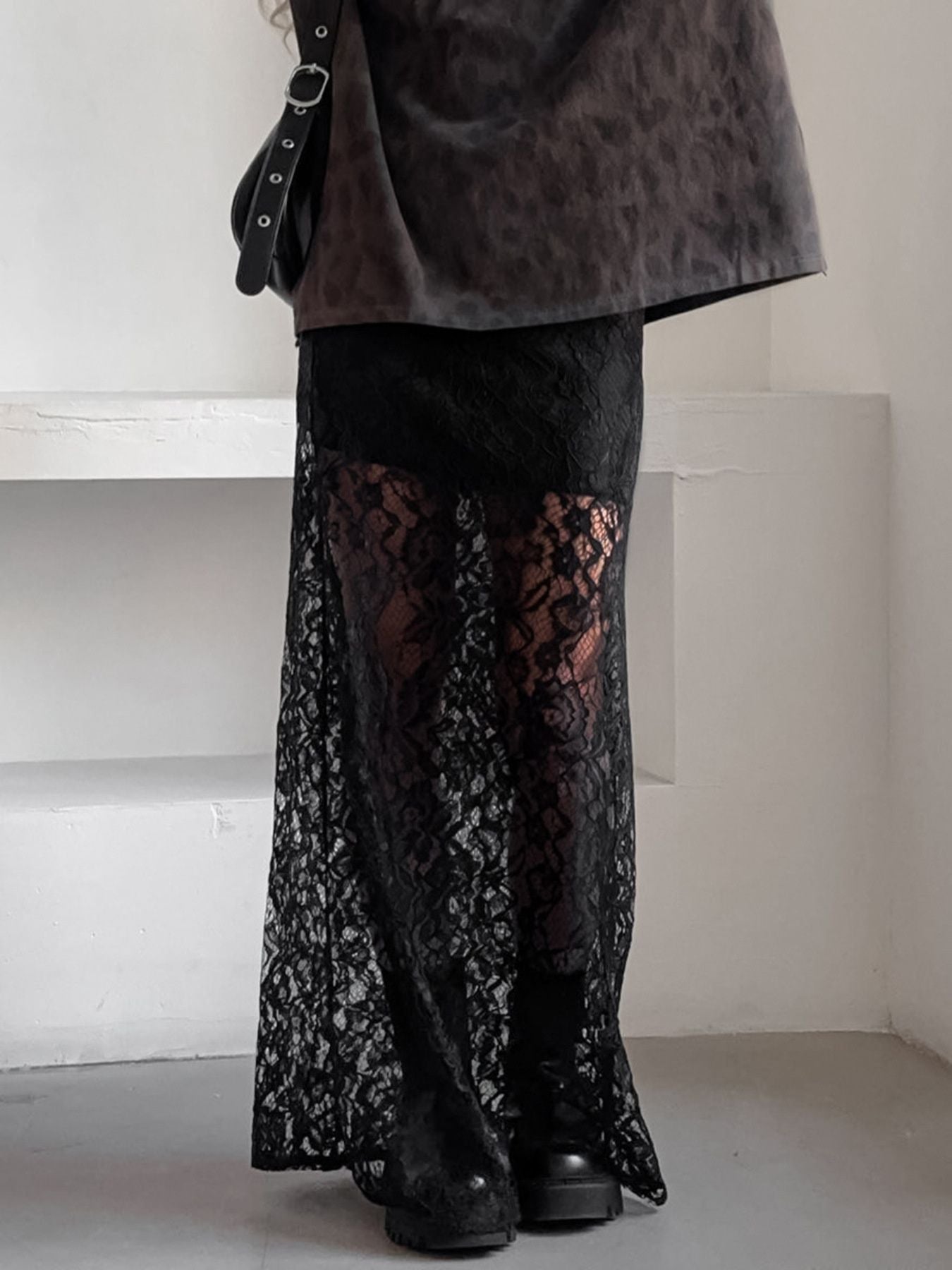 Lace Sheer Maxi Skirt showcasing detailed floral pattern and sheer finish, styled with a fitted waist for summer chic look.