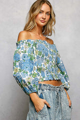 POL Floral Print Smocked Off-Shoulder Blouse featuring floral pattern and puffed sleeves, styled with jeans.