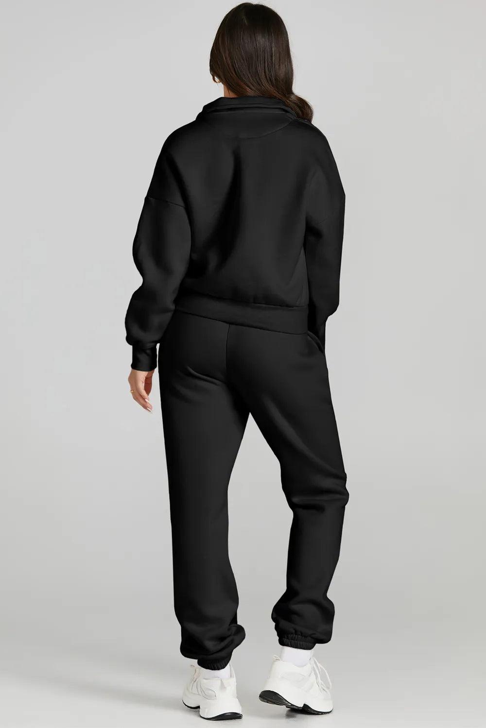 Woman wearing black Quarter Zip Top and Drawstring Pants Active Set, showcasing comfortable and stylish activewear for casual occasions.