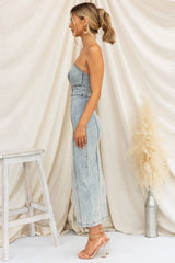 Side profile of strapless light blue denim midi dress with form-fitting seams and clean hemline for a sleek look.