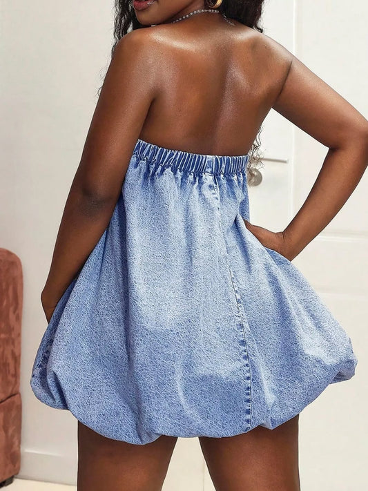Back view of Strapless Tube Bubble Hem Denim Dress in soft sky-blue denim wash, showing playful bubble hem silhouette.