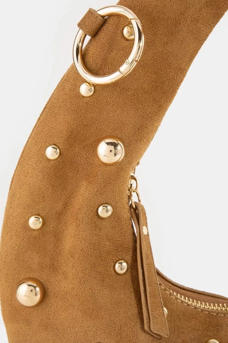 Close-up of Fame Dome Studded Chrome Crescent Hand Bag with gold studs and ring detail, highlighting the unique crescent design.