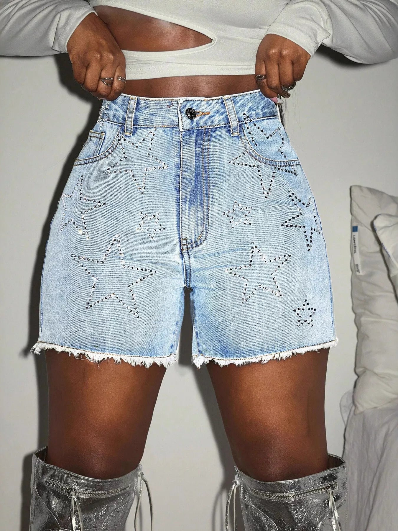 Star Raw Hem Denim Shorts with star pattern and frayed edges, perfect for a sporty and edgy style.
