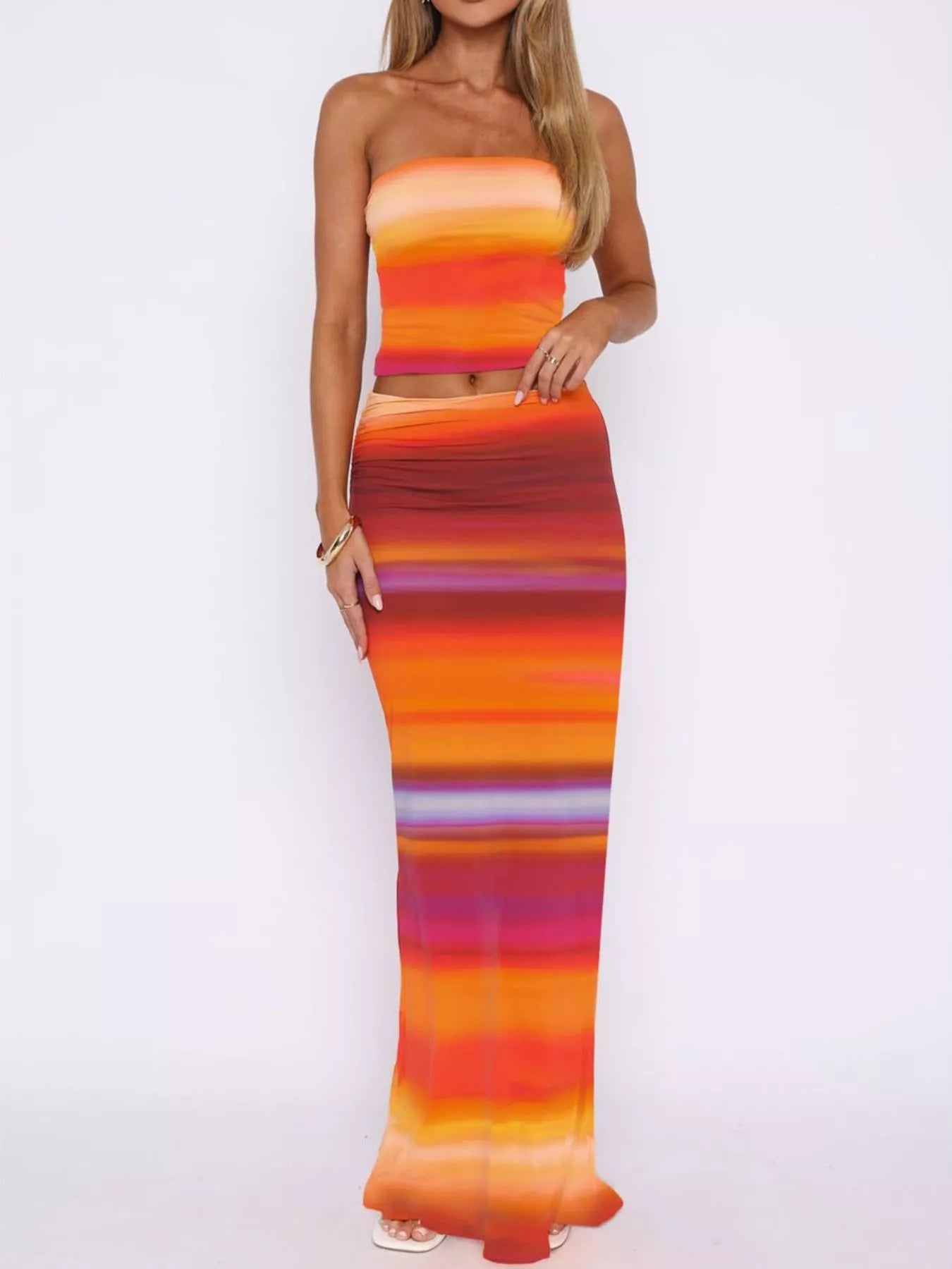 Woman wearing colorful Striped Tube Top and Skirt Set, featuring basic style and slightly stretchy polyester material.