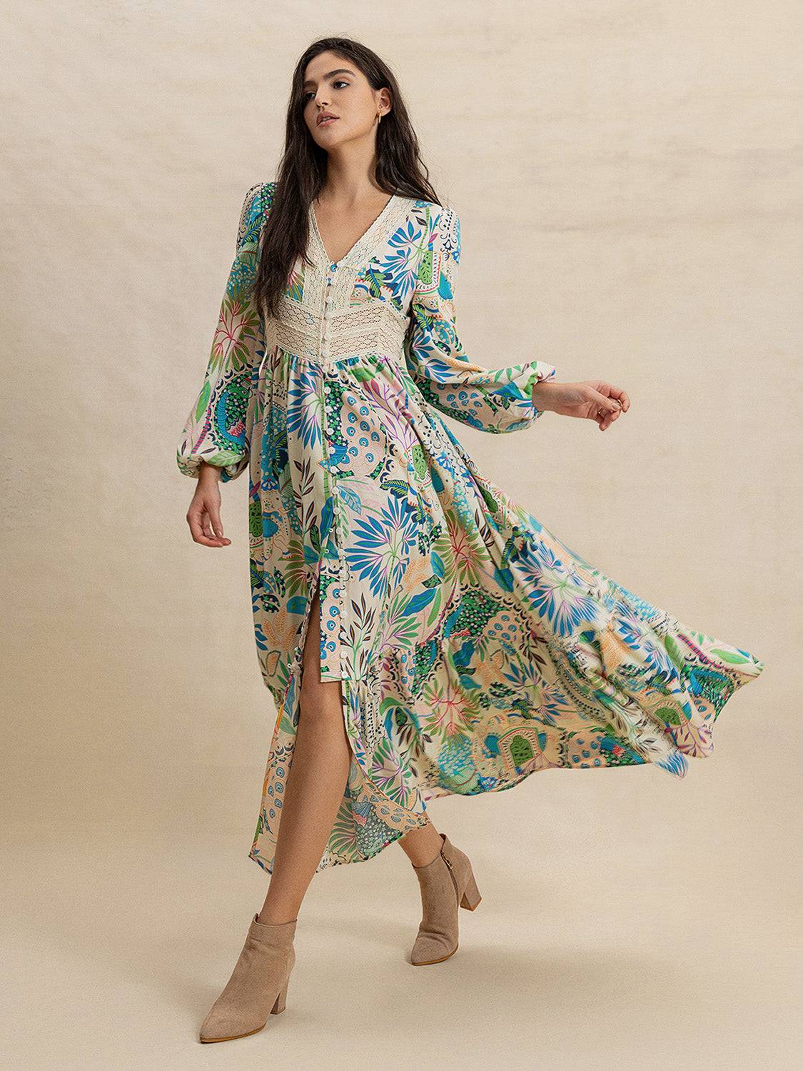 Effortlessly Chic Slit Printed V-Neck Long Sleeve Midi Dress with floral patterns, flowing hem, and neutral ankle boots in motion.