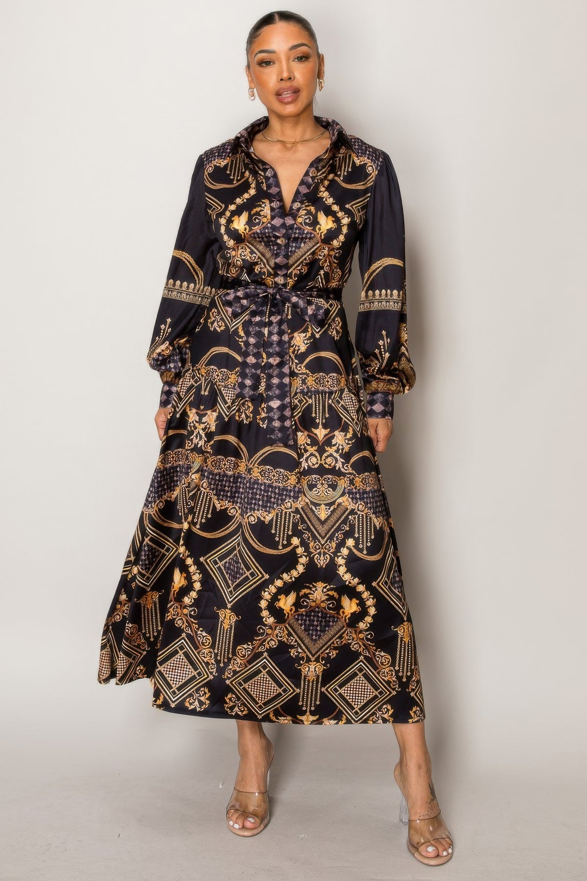 Woman wearing Resort Wear Maxi Dress with gold baroque patterns on a dark backdrop, perfect for luxury vacations and resort events.