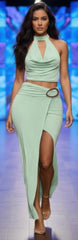 Model wearing Halter Cowl Oval Ring Skirt Set in mint green, featuring a halter top with a cowl neckline and oval ring skirt detail.