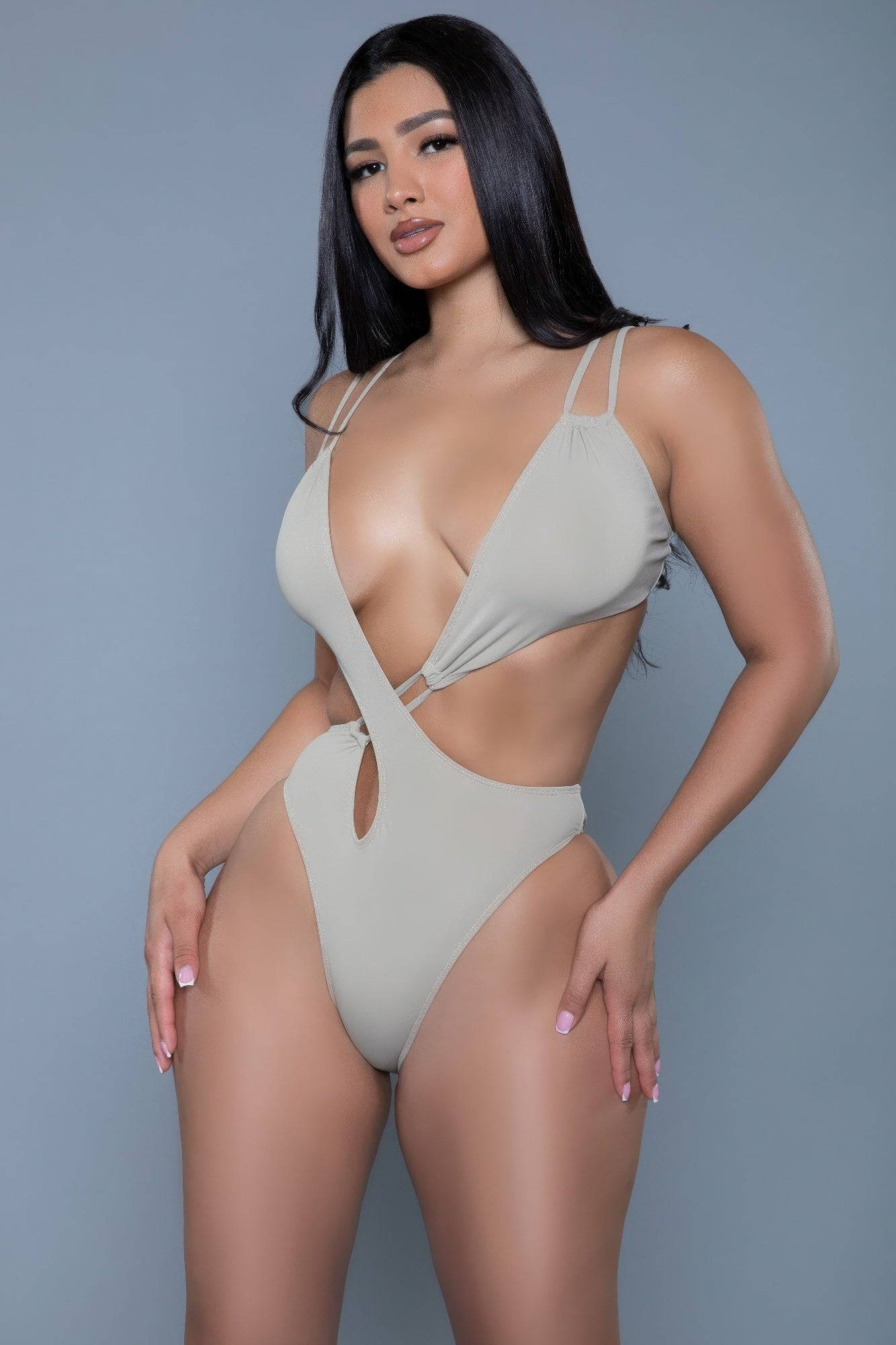 Front view of nude Eliana Swimsuit with plunging neckline and crisscross waist, designed for confident style and adjustable comfort.