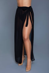 Close-up of Rhea Skirt White in black, showcasing sheer material and adjustable side tie for customizable beachwear fit.