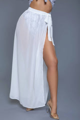 Close-up of Rhea Skirt White in white, featuring sheer fabric and side tie detail for a breezy, stylish beachwear look.