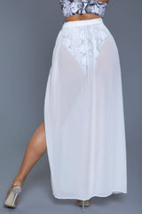 Back view of Rhea Skirt White in white, showing sheer fabric and flattering fit perfect for swimwear cover-up styling.