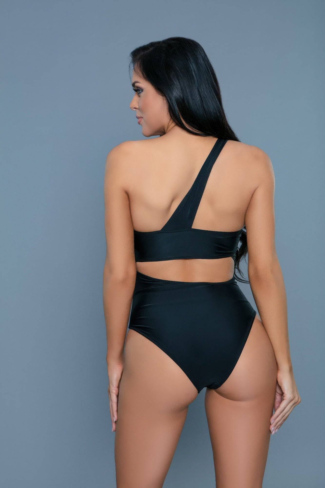 Rear view of Kennedy Swimsuit in black, featuring a high-cut leg and one-shoulder strap for a modern and flattering swimwear fit.