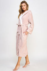 Side angle of Janette Pink Robe showcasing soft texture, hooded design, and deep pockets for added warmth and functionality.