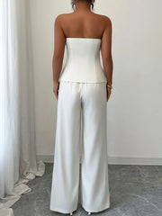 Back view of a stylish tube top and wide-leg pants set in white, perfect for casual outings or brunch dates.
