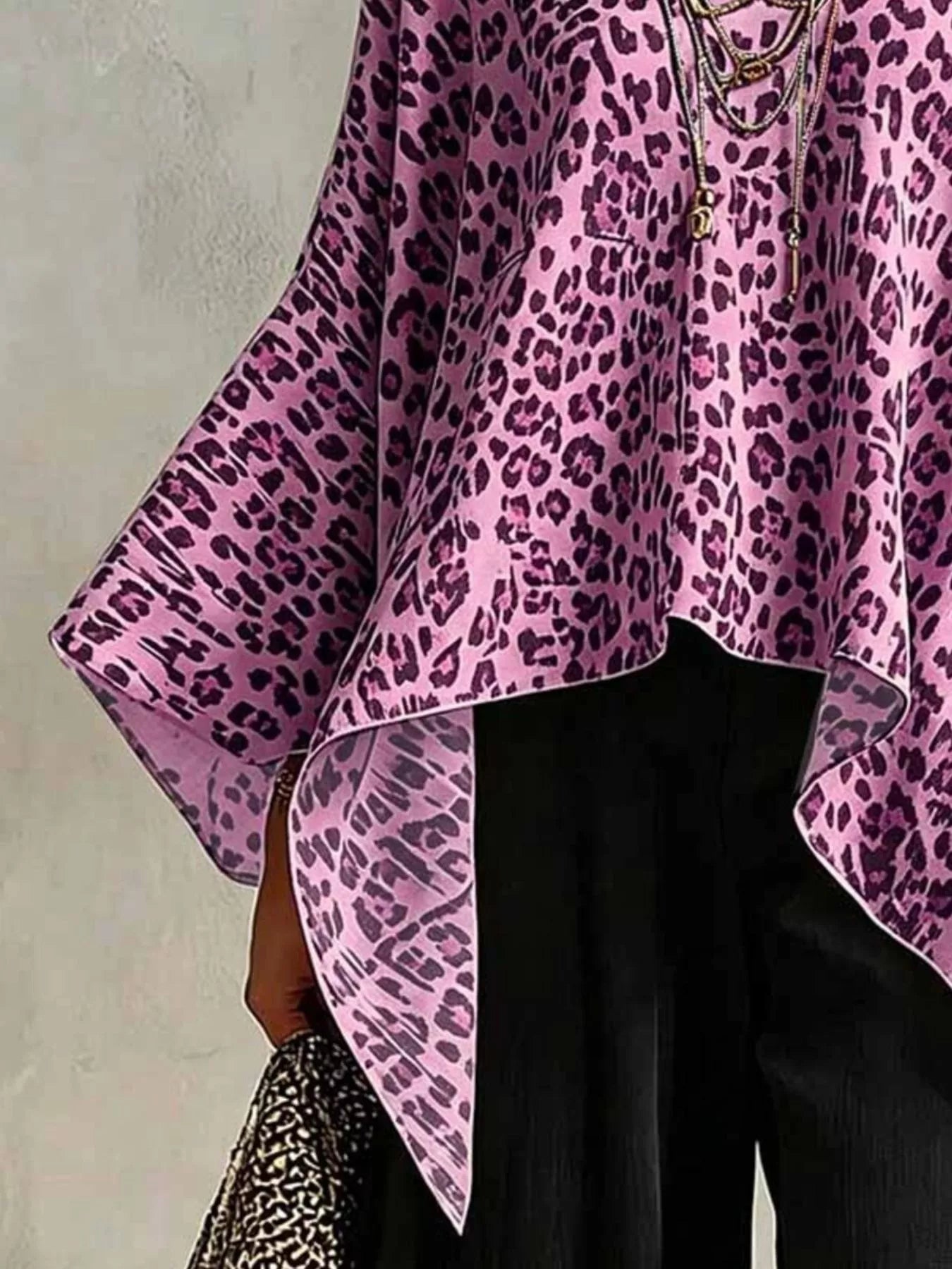 Asymmetrical Leopard Print Top Plus Size featuring a pink leopard pattern and stylish flowy design.