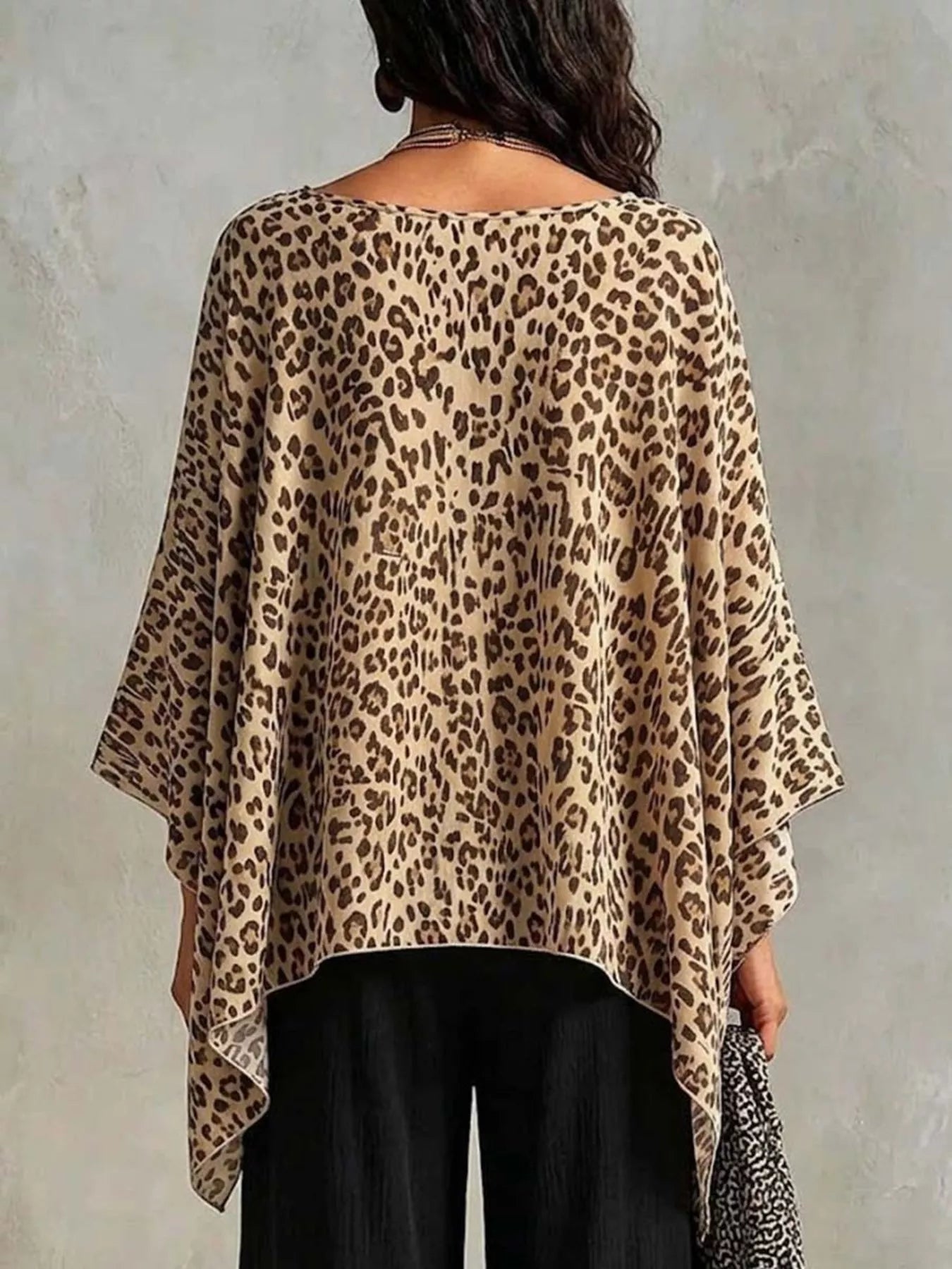 Asymmetrical Leopard Print Top Plus Size showing back view with a stylish leopard pattern and relaxed fit.