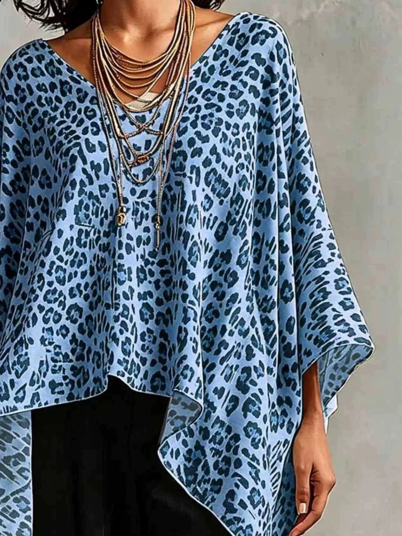 Asymmetrical Leopard Print Top Plus Size featuring a blue leopard pattern, perfect for stylish plus-size fashion.