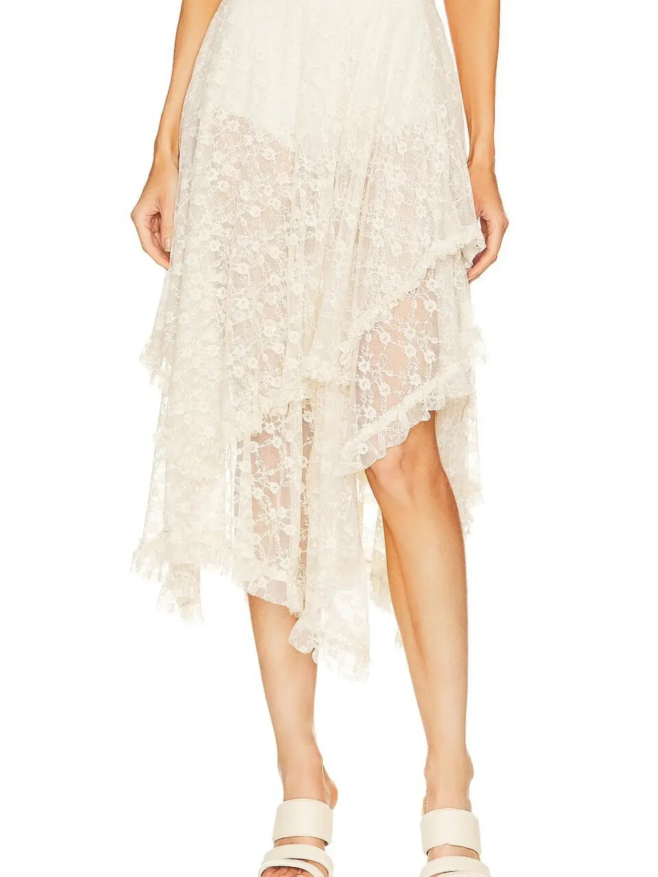 Asymmetrical lace midi skirt with sheer detailing and partial lining, offering a flattering silhouette and modern chic style.