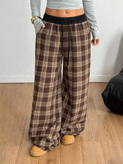 Model wearing GirlSavvi’s Plaid Wide Leg Pants with adjustable drawstring and functional pockets for casual or elevated styling.