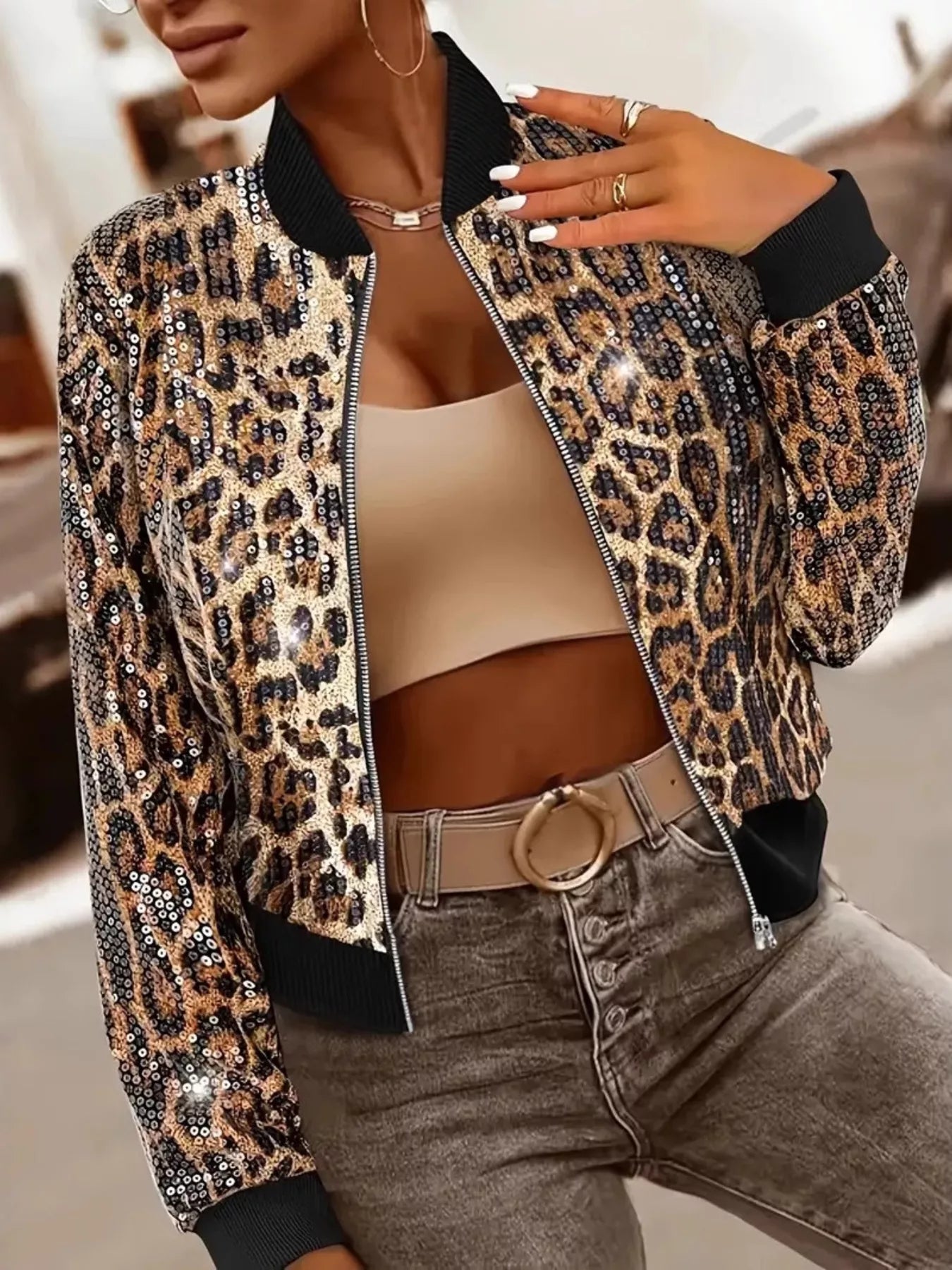 Woman wearing GS Sequin Leopard Zip Up Jacket with sequins and leopard print, highlighting stylish design and casual fashion.