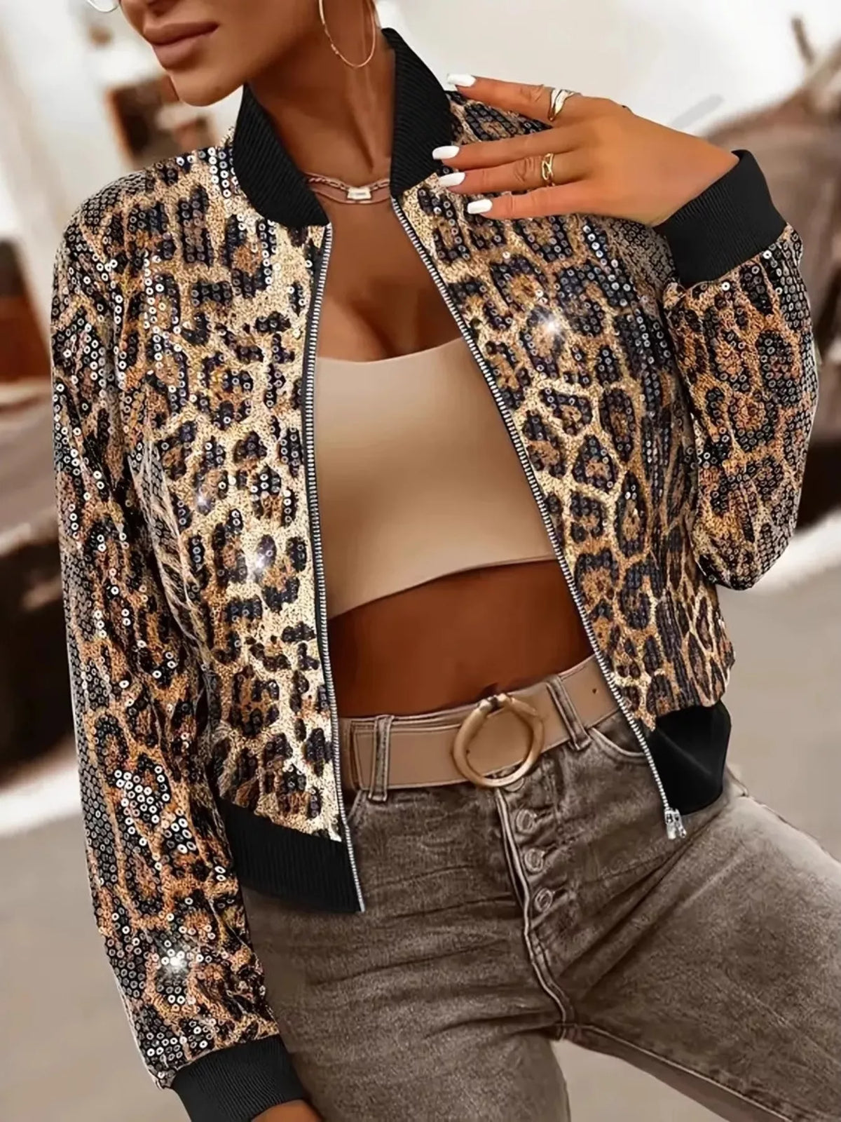 Woman wearing GS Sequin Leopard Zip Up Jacket with sequins and leopard print, highlighting stylish design and casual fashion.