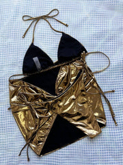 Flat lay of the 3-piece Halter Neck Bikini Set in metallic gold, including halter top, tie-side bottoms, and matching cover-up skirt.