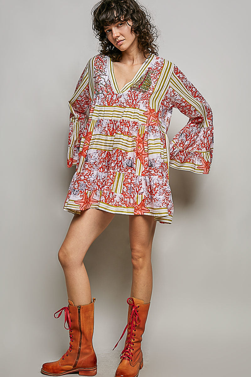 POL Striped Floral Long Sleeve Mini Dress with Pintuck Detail in coral and starfish print, featuring a V-neckline and ruffled cuffs.